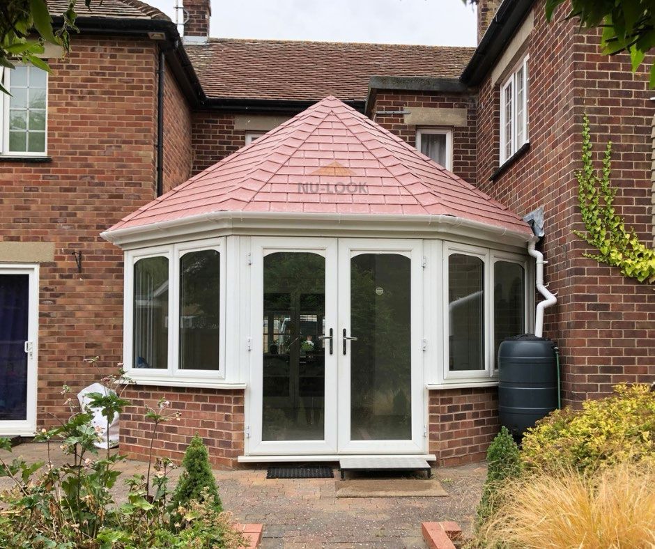 After: glass roof replaced with a tiled roof in Red Rock
