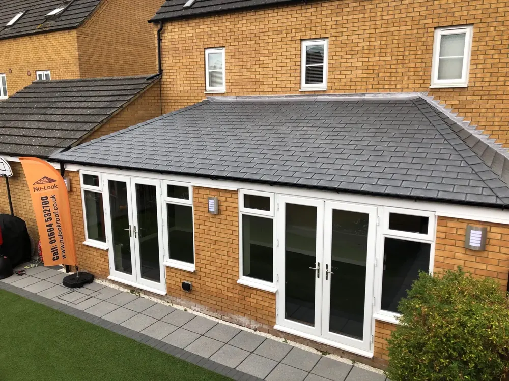 Hipped Lean to conservatory with a tiled roof fitted by Nu-Look